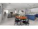 Open-concept living area with a view of the kitchen, featuring a dining table and comfortable seating at 3268 Grayson Lake Ct, Las Vegas, NV 89129
