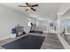 Upstairs loft area with exercise equipment, large mirror and a ceiling fan at 3268 Grayson Lake Ct, Las Vegas, NV 89129