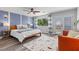 Serene main bedroom with a calming color palette, a ceiling fan, and access to a balcony at 3268 Grayson Lake Ct, Las Vegas, NV 89129