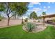Fully fenced backyard with covered patio, and mature landscaping at 36 Trailside Ct, Henderson, NV 89012