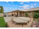 Relaxing backyard featuring a covered patio and a private hot tub for outdoor enjoyment at 36 Trailside Ct, Henderson, NV 89012