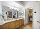 Spacious bathroom with dual sinks, a large mirror, and access to a walk-in closet at 36 Trailside Ct, Henderson, NV 89012