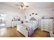 Bedroom with wood floors, ceiling fan and dresser at 36 Trailside Ct, Henderson, NV 89012