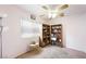 Bedroom featuring fan, and a bright window with bookshelves at 36 Trailside Ct, Henderson, NV 89012