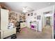 Bedroom with ceiling fan, desk, shelving, and doorway to hallway at 36 Trailside Ct, Henderson, NV 89012