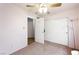 Bedroom featuring a ceiling fan, closet and two entryways at 36 Trailside Ct, Henderson, NV 89012