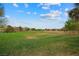 Expansive green space with a lush grass field offers room for various outdoor activities and relaxation at 36 Trailside Ct, Henderson, NV 89012