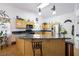 Bright eat-in kitchen with wood cabinets, granite counters, and stainless steel appliances at 36 Trailside Ct, Henderson, NV 89012