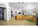 Open-concept kitchen with granite counters and seamlessly connected to living spaces at 36 Trailside Ct, Henderson, NV 89012