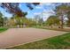 Outdoor sand volleyball court surrounded by green grass and trees in the community park at 36 Trailside Ct, Henderson, NV 89012