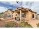 Inviting backyard with a covered patio, pool, spa, and low maintenance landscaping, perfect for outdoor living and entertaining at 4417 Gracemont Ave, Las Vegas, NV 89139