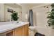Bright bathroom features a white vanity, toilet, tub, shower, and neutral wall color at 4417 Gracemont Ave, Las Vegas, NV 89139
