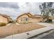 Charming single-story home with desert landscaping and a two-car garage offers curb appeal at 4417 Gracemont Ave, Las Vegas, NV 89139