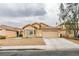 Inviting single-story home with a low-maintenance front yard and an attached two-car garage at 4417 Gracemont Ave, Las Vegas, NV 89139