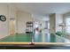 Game room with a billiards table, tile floors, and open layout flowing into other living areas at 4417 Gracemont Ave, Las Vegas, NV 89139