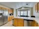 Bright open kitchen with stainless steel appliances and breakfast nook at 4417 Gracemont Ave, Las Vegas, NV 89139