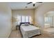 Spacious main bedroom with a view of ensuite bathroom, ceiling fan and plantation shutters at 4417 Gracemont Ave, Las Vegas, NV 89139