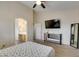 Spacious main bedroom with ensuite bathroom, television, and modern furnishings at 4417 Gracemont Ave, Las Vegas, NV 89139