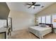 Large bedroom features a ceiling fan, plantation shutters, and modern furnishings at 4417 Gracemont Ave, Las Vegas, NV 89139