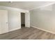 This bedroom features fresh paint, new gray floors, closet, and white trim at 5055 W Hacienda Ave # 2055, Las Vegas, NV 89118