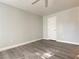 This bedroom features fresh paint, new gray floors, closet, and white trim at 5055 W Hacienda Ave # 2055, Las Vegas, NV 89118