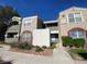 Condo building featuring two-story architecture and well-maintained landscaping at 5055 W Hacienda Ave # 2055, Las Vegas, NV 89118