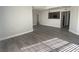 Open floor plan featuring wood-look floors and bar to kitchen at 5055 W Hacienda Ave # 2055, Las Vegas, NV 89118