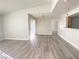 Open-concept living area with abundant natural light and vinyl plank flooring at 5055 W Hacienda Ave # 2055, Las Vegas, NV 89118