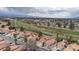 Community aerial view with golf course and city skyline in the background at 5328 Walton Heath Ave, Las Vegas, NV 89142