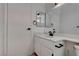 Cozy bathroom features modern vanity with sink, mirror, and tile flooring at 5328 Walton Heath Ave, Las Vegas, NV 89142