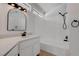 Bathroom featuring a single vanity with modern black fixtures and a shower-tub combination at 5328 Walton Heath Ave, Las Vegas, NV 89142