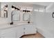 Bathroom featuring a dual sink vanity with white cabinets and modern black fixtures at 5328 Walton Heath Ave, Las Vegas, NV 89142