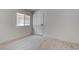 Bright bedroom features a window, neutral walls, and wood-look flooring at 5328 Walton Heath Ave, Las Vegas, NV 89142