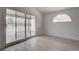 Bedroom with laminate floors and sliding glass doors leading to a covered outdoor patio at 5328 Walton Heath Ave, Las Vegas, NV 89142