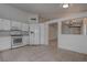 Clean kitchen with white cabinets, tile floors, and neutral countertops at 5328 Walton Heath Ave, Las Vegas, NV 89142