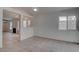 Living room leading into other rooms; new tile flooring, fireplace, and large window at 5328 Walton Heath Ave, Las Vegas, NV 89142