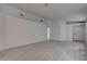 Spacious living room with new wood flooring, fresh paint, and a neutral color palette at 5328 Walton Heath Ave, Las Vegas, NV 89142