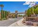 The gated entrance to Aberdeen is framed by lush greenery and stately stone monuments with decorative lion accents at 5641 Morning Snow Ct, Las Vegas, NV 89141