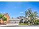 Charming single-story home boasts a three-car garage and well-maintained landscaping at 5641 Morning Snow Ct, Las Vegas, NV 89141