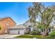 Beautiful home with a three-car garage, manicured lawn, and mature landscaping at 5641 Morning Snow Ct, Las Vegas, NV 89141