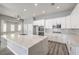 Bright kitchen with a large island, quartz countertops, and lots of storage at 5641 Morning Snow Ct, Las Vegas, NV 89141