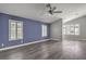 Open-concept living room features hardwood flooring and lots of natural light at 5641 Morning Snow Ct, Las Vegas, NV 89141