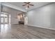 Expansive living area showcasing hardwood floors, modern lighting, and stylish design elements at 5641 Morning Snow Ct, Las Vegas, NV 89141