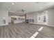 Open-concept living room with a fireplace and access to the backyard at 5641 Morning Snow Ct, Las Vegas, NV 89141