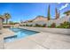 Stunning pool and backyard landscaping with an outdoor kitchen in a private oasis at 5641 Morning Snow Ct, Las Vegas, NV 89141