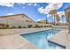 Inviting backyard pool featuring lush landscaping, patio, and clear blue skies at 5641 Morning Snow Ct, Las Vegas, NV 89141