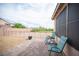 Charming backyard featuring pavers, gravel, chairs and views of the back fence at 5815 Pristine Falls Ave, Las Vegas, NV 89131