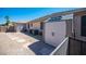 Backyard features a storage shed, air conditioning units, and low-maintenance desert landscaping at 5815 Pristine Falls Ave, Las Vegas, NV 89131