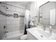 This bathroom has modern tile, sleek fixtures, and built-in shelving at 5815 Pristine Falls Ave, Las Vegas, NV 89131