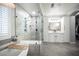 Modern bathroom features a soaking tub, glass-enclosed shower, and dual vanity at 5815 Pristine Falls Ave, Las Vegas, NV 89131